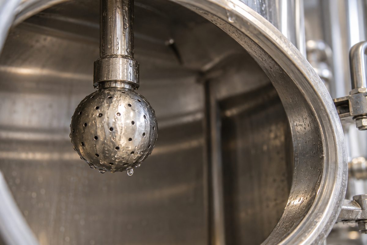 Stainless CIP spray ball inside a tank opening